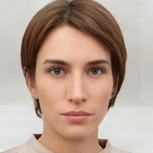 Neutral white young-adult female with short  brown hair and brown eyes