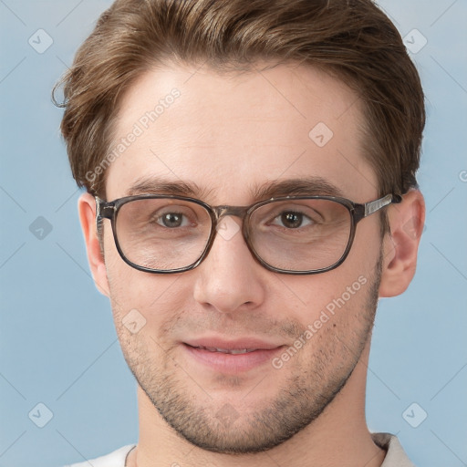 Joyful white adult male with short  brown hair and grey eyes