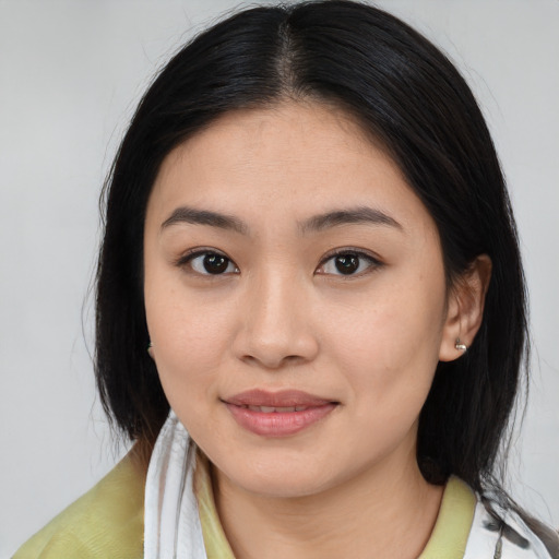 Joyful white young-adult female with medium  brown hair and brown eyes