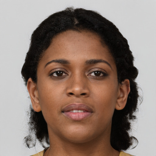 Neutral black young-adult female with short  black hair and brown eyes