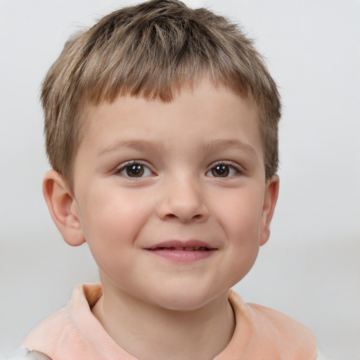 Joyful white child male with short  brown hair and brown eyes