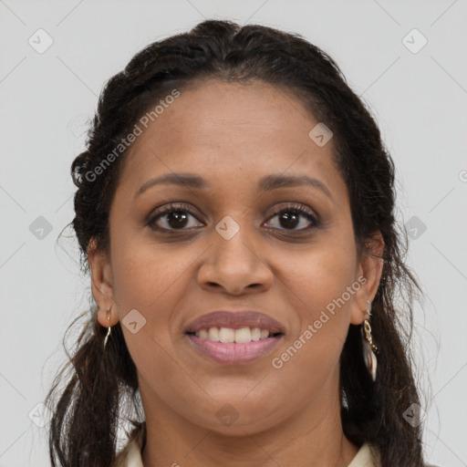 Joyful black young-adult female with long  brown hair and brown eyes