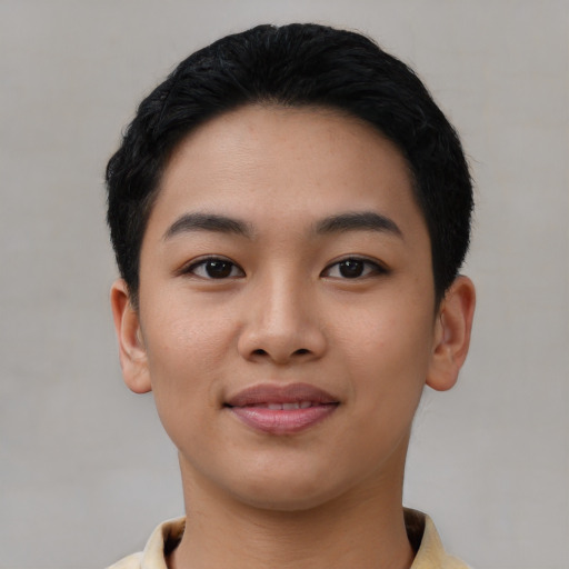Joyful asian young-adult female with short  black hair and brown eyes