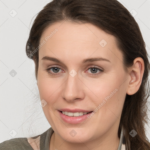 Joyful white young-adult female with medium  brown hair and grey eyes