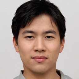 Neutral asian young-adult male with short  brown hair and brown eyes