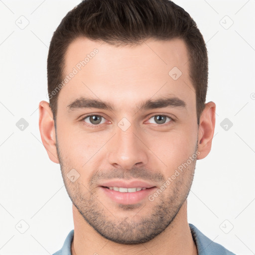 Joyful white young-adult male with short  brown hair and brown eyes