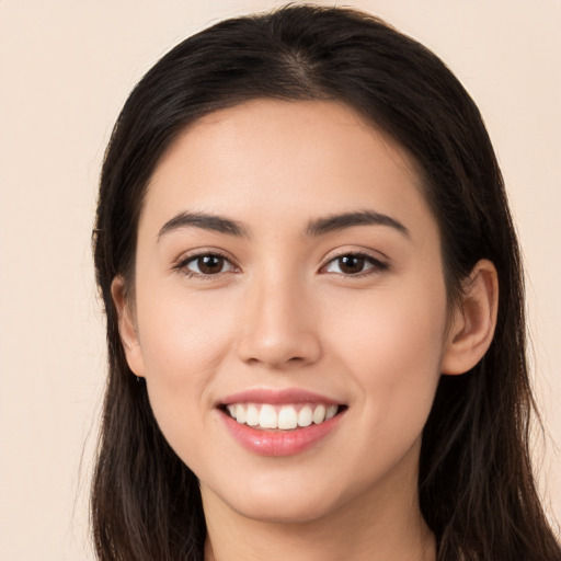 Joyful white young-adult female with long  brown hair and brown eyes