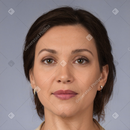 Joyful white adult female with medium  brown hair and brown eyes