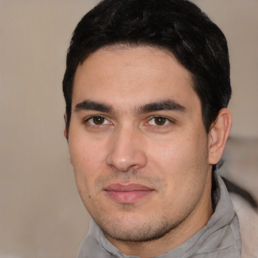 Joyful white young-adult male with short  black hair and brown eyes