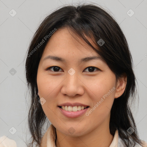 Joyful asian young-adult female with medium  brown hair and brown eyes