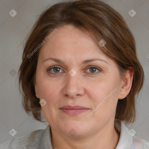 Joyful white adult female with medium  brown hair and blue eyes