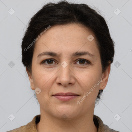 Joyful white adult female with short  brown hair and brown eyes