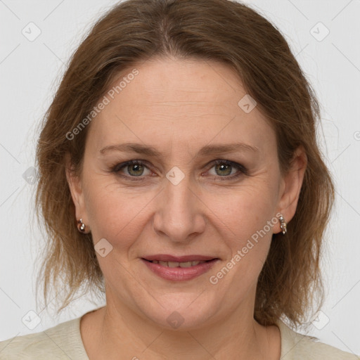 Joyful white adult female with medium  brown hair and grey eyes