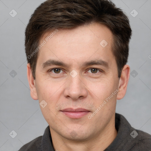 Joyful white adult male with short  brown hair and grey eyes