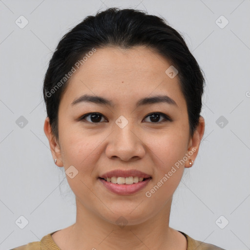 Joyful latino young-adult female with short  brown hair and brown eyes