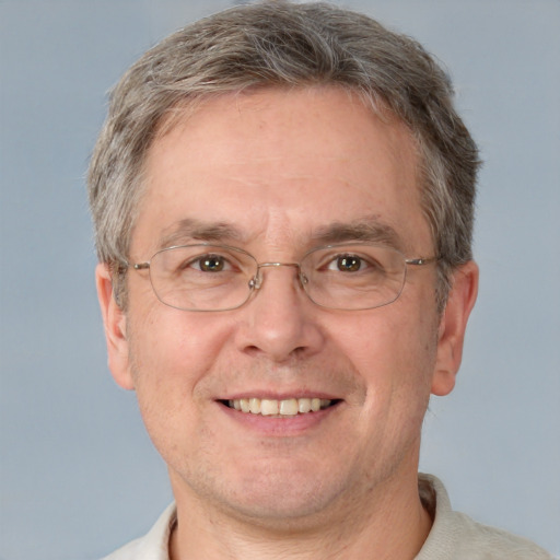 Joyful white middle-aged male with short  brown hair and grey eyes