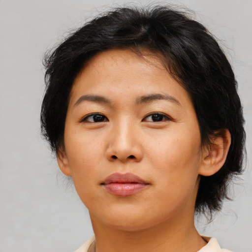 Neutral asian young-adult female with medium  brown hair and brown eyes