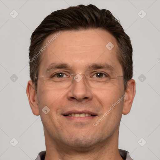 Joyful white adult male with short  brown hair and brown eyes