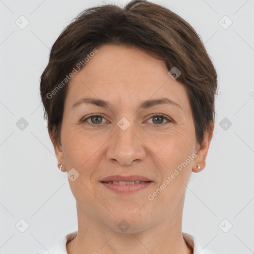 Joyful white adult female with short  brown hair and brown eyes