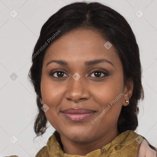 Joyful black young-adult female with medium  brown hair and brown eyes