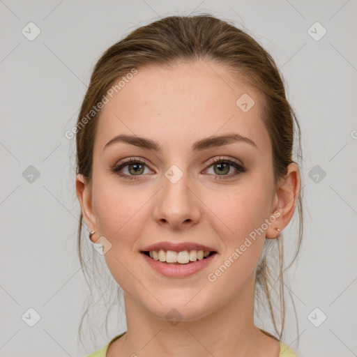 Joyful white young-adult female with medium  brown hair and green eyes