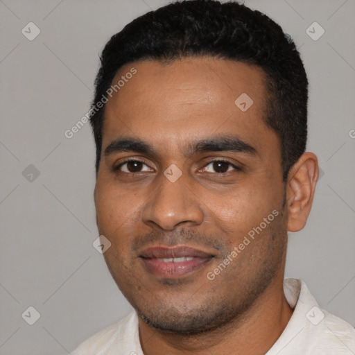 Joyful black young-adult male with short  black hair and brown eyes