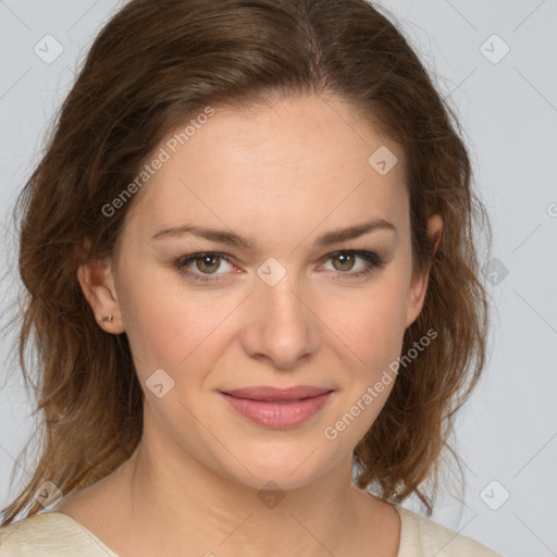 Joyful white young-adult female with medium  brown hair and green eyes