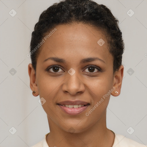 Joyful black young-adult female with short  brown hair and brown eyes