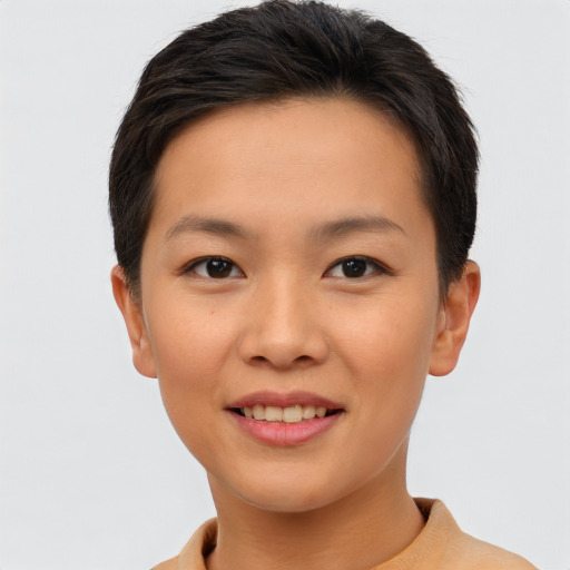 Joyful asian young-adult female with short  brown hair and brown eyes