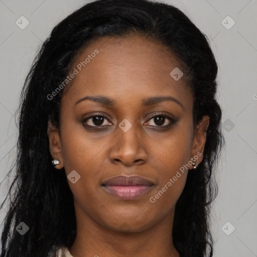 Joyful black young-adult female with long  brown hair and brown eyes