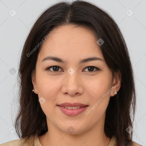 Joyful latino young-adult female with medium  brown hair and brown eyes