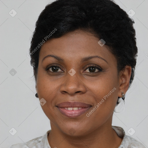 Joyful black adult female with short  brown hair and brown eyes