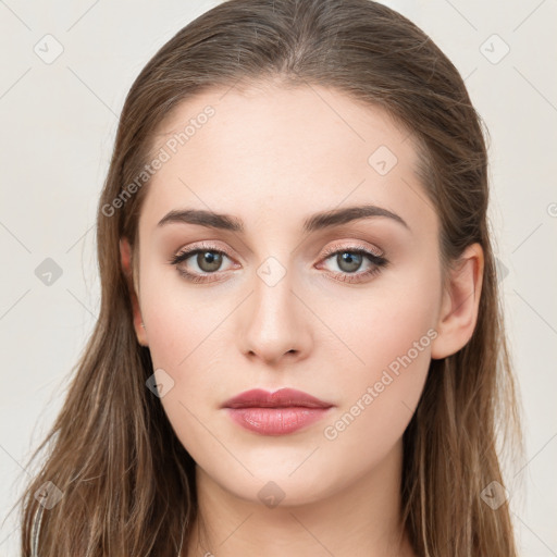 Neutral white young-adult female with long  brown hair and brown eyes