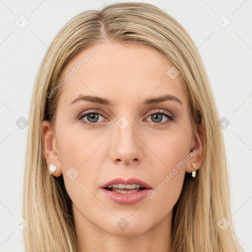 Joyful white young-adult female with long  brown hair and blue eyes