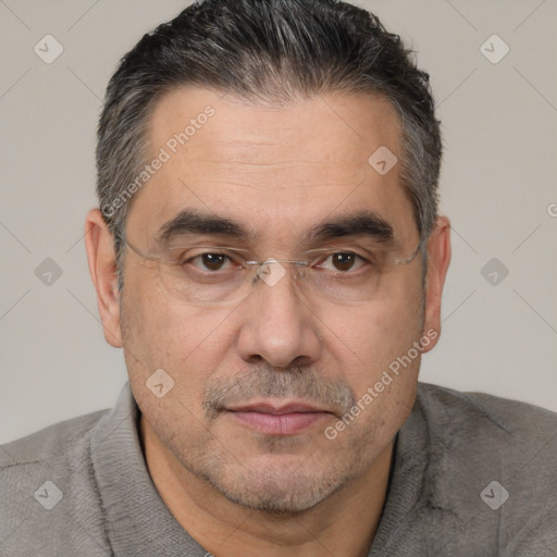 Joyful white adult male with short  black hair and brown eyes