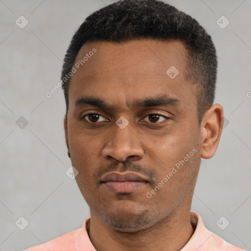 Neutral latino young-adult male with short  black hair and brown eyes