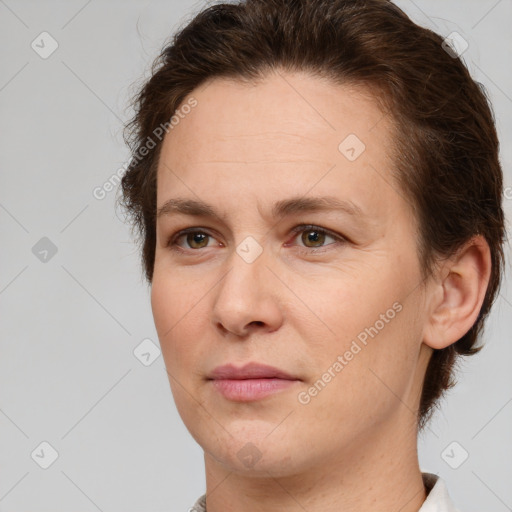 Joyful white adult female with short  brown hair and brown eyes