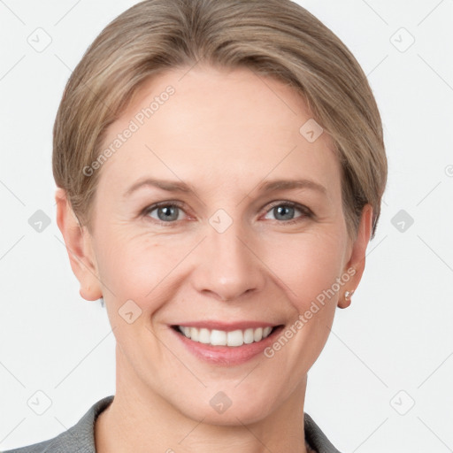 Joyful white young-adult female with short  brown hair and grey eyes