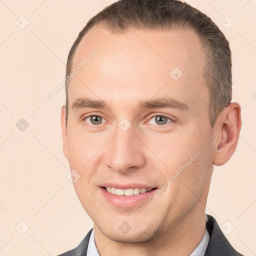 Joyful white young-adult male with short  brown hair and brown eyes