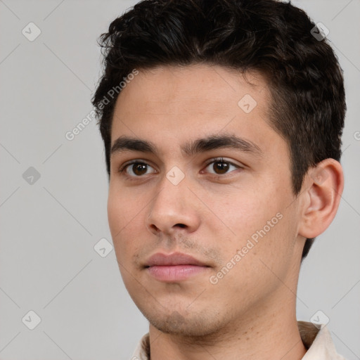 Neutral white young-adult male with short  black hair and brown eyes