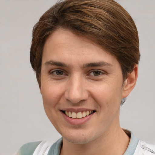 Joyful white young-adult female with short  brown hair and grey eyes