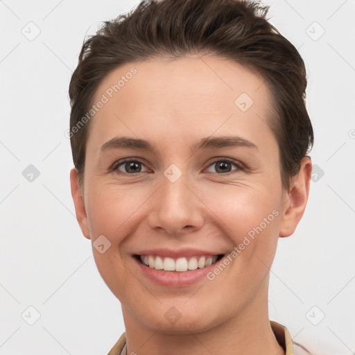 Joyful white young-adult female with short  brown hair and brown eyes