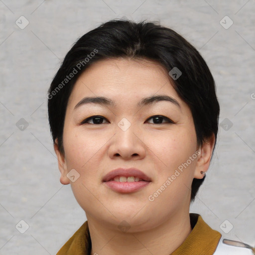 Joyful asian young-adult female with short  black hair and brown eyes