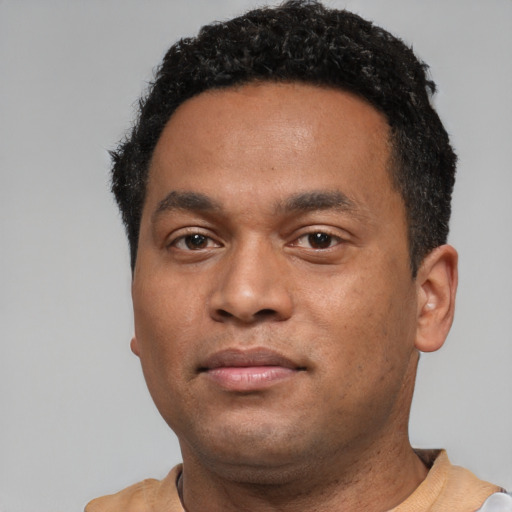 Neutral black young-adult male with short  black hair and brown eyes