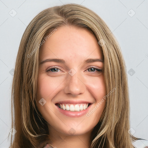 Joyful white young-adult female with long  brown hair and green eyes