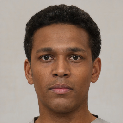 Neutral black young-adult male with short  brown hair and brown eyes