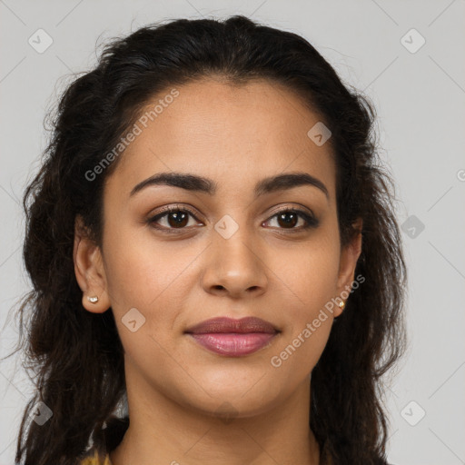 Joyful latino young-adult female with long  brown hair and brown eyes