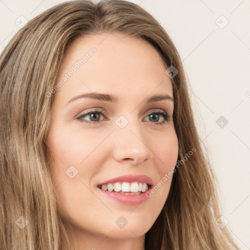 Joyful white young-adult female with long  brown hair and green eyes