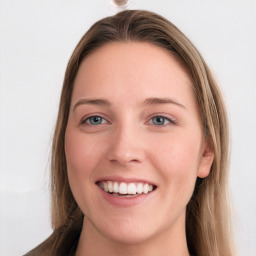 Joyful white young-adult female with long  brown hair and blue eyes