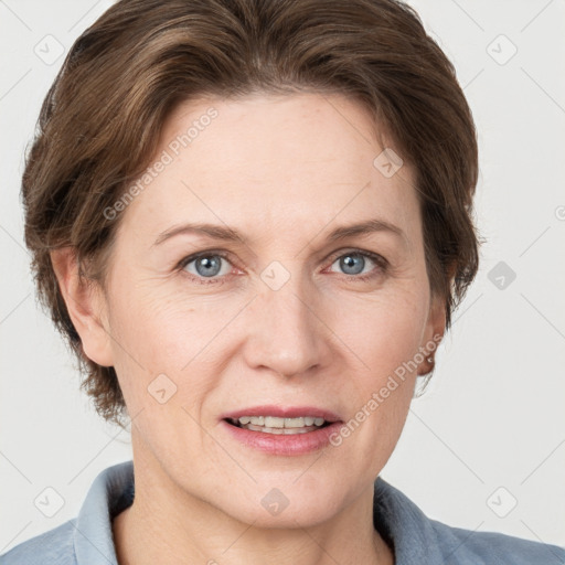 Joyful white adult female with short  brown hair and grey eyes